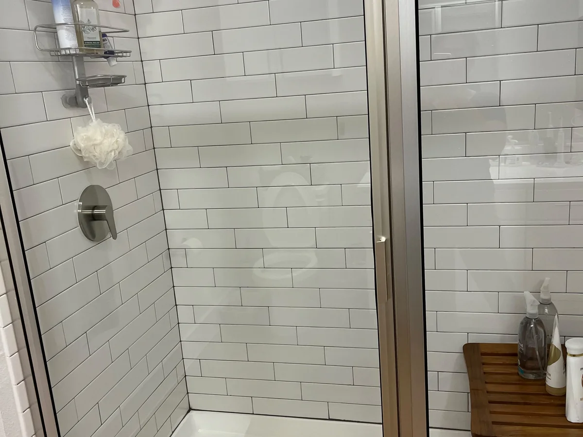 Glass shower and subway tile left spotless